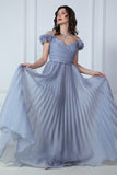 Gray evening dress with ruffle sleeves