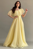 Yellow one-shoulder cloche dress with layers of ruffles