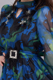 Blue dress with embroidery on the chest and decorated with feathers