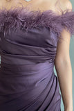 Satin dress decorated with mauve feathers