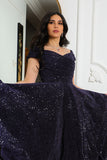 Mid-length evening dress decorated with navy blue sequins