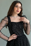 Black tulle evening dress decorated with beads