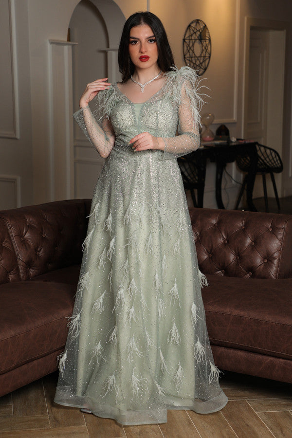Light green feather-embellished off-shoulder evening dress