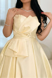 Yellow evening dress with a bow