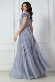 Gray evening dress with ruffle sleeves