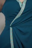 Maxi dress with tulle sleeves decorated with a turquoise crystal ribbon