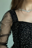 Black tulle evening dress decorated with beads