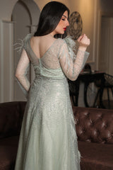 Light green feather-embellished off-shoulder evening dress