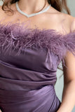 Satin dress decorated with mauve feathers