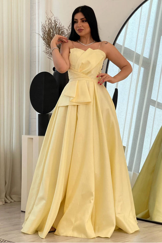 Yellow evening dress with a bow